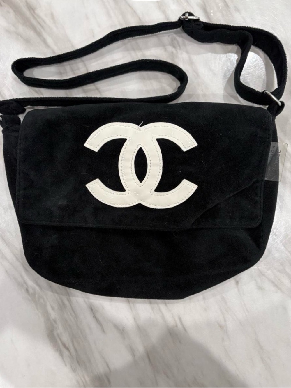 Black Suede Crossbody Bag with White CC Logo
Cute!